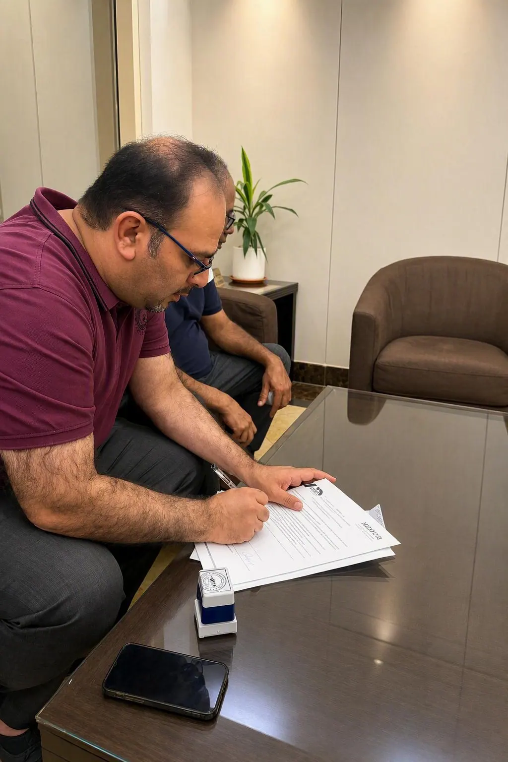 Noor Al Rizq representatives signing a partnership agreement